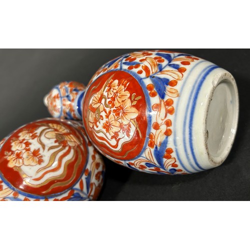 77A - Pair of 19th century gourd shaped Imari vases with traditional floral detail