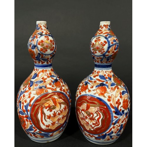 77A - Pair of 19th century gourd shaped Imari vases with traditional floral detail