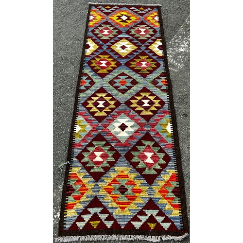 1551 - Chobi kilim, with an all over brightly coloured stepped diamond pattern, 154cm x 97cm