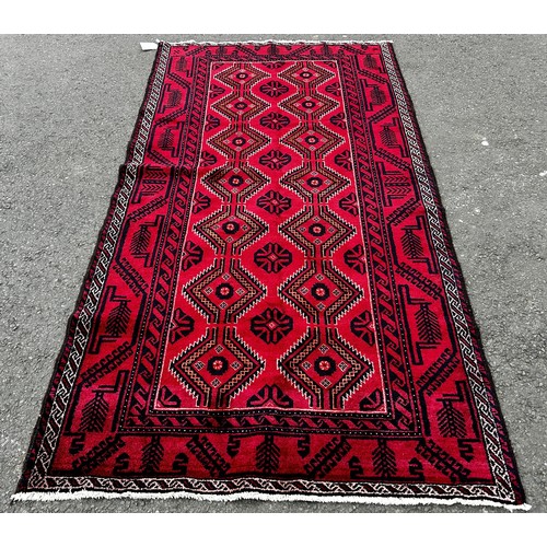 1556 - North East Persian meshed Belouch rug, with an all over diamond pattern on a predominantly red groun... 