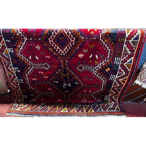 1561 - South West Persian Lori carpet with a red and gold geometric pattern, 2.55m x 1.68m approx