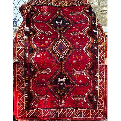 South West Persian Lori carpet with a red and gold geometric pattern, 2.55m x 1.68m approx