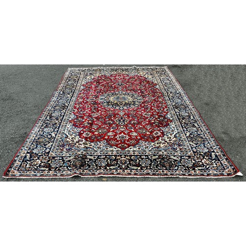 1575 - Central Persian Isfahan carpet, with an all over floral pattern on a dark blue ground 3.50m x 2.40m