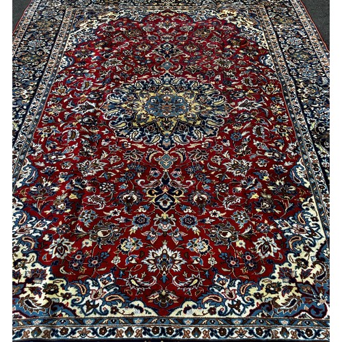 1575 - Central Persian Isfahan carpet, with an all over floral pattern on a dark blue ground 3.50m x 2.40m