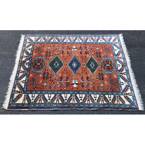 1548 - Persian rug with brick ground field, five medallion centre, set within running borders, 195 x 145 cm