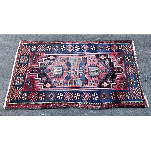 1550 - Vintage Persian rug with central tribal design and repeated pattern border, in tones of indigo, ceru... 