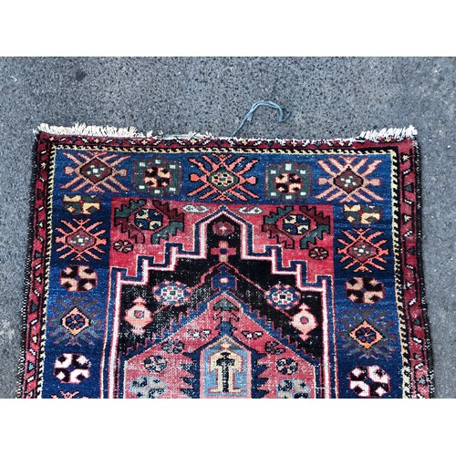 1550 - Vintage Persian rug with central tribal design and repeated pattern border, in tones of indigo, ceru... 