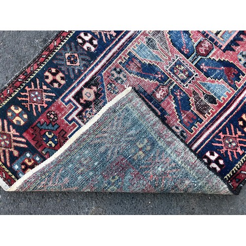 1550 - Vintage Persian rug with central tribal design and repeated pattern border, in tones of indigo, ceru... 