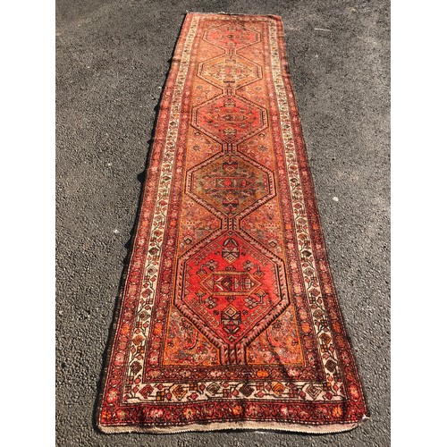 1584 - Vintage Persian Runner, with a run of five hexagonal medallions in amber, iron red and natural wool ... 