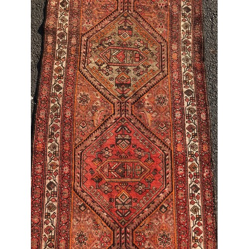 1584 - Vintage Persian Runner, with a run of five hexagonal medallions in amber, iron red and natural wool ... 