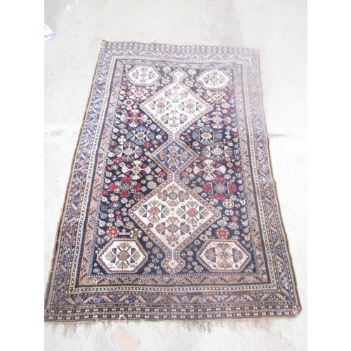 1581 - A Khameseh type carpet with three interlocking medallions 184cm x 150cm