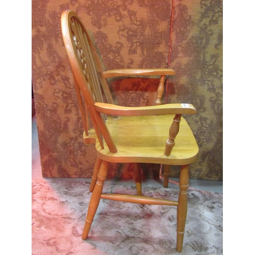 1110 - A set of six modern beech Windsor wheel back dining chairs (4&2)