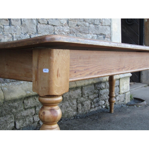 1155 - A stripped pine farmhouse kitchen table, the rectangular top with moulded outline and rounded corner... 