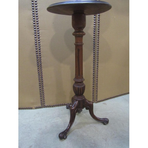 1166 - A Victorian walnut shaving stand with adjustable circular framed mirror, raised on a fluted colum an... 