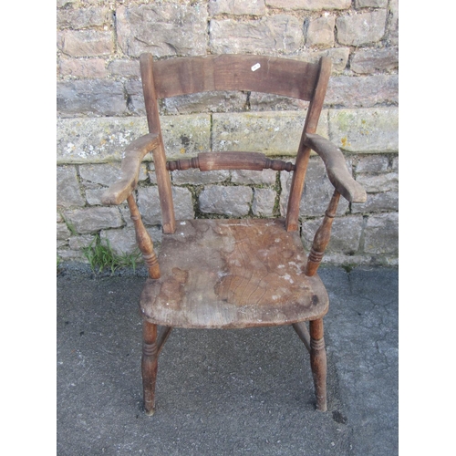 1257 - A Windsor bar-back kitchen chair with shaped arms