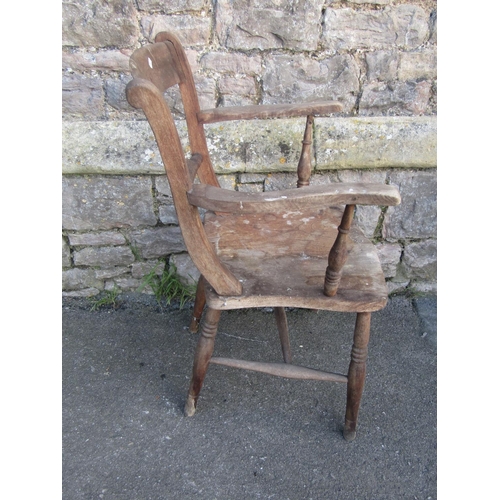 1257 - A Windsor bar-back kitchen chair with shaped arms