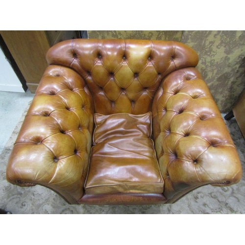 1273 - A Pair of good quality contemporary but traditional style tan leather button back armchairs, raised ... 