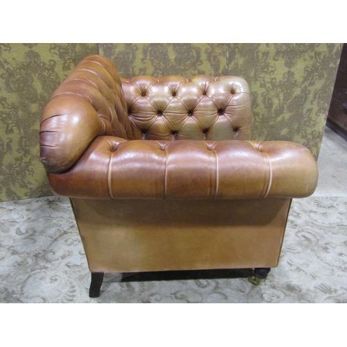 1273 - A Pair of good quality contemporary but traditional style tan leather button back armchairs, raised ... 