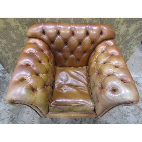 1273 - A Pair of good quality contemporary but traditional style tan leather button back armchairs, raised ... 