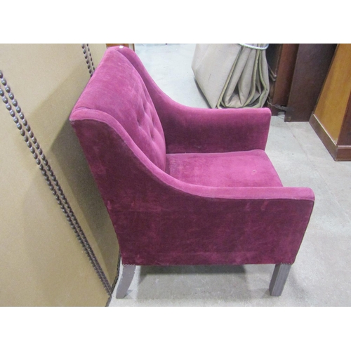 1276 - A Georgian style upholstered easy chair with down swept arms and simple button back, raised on paint... 