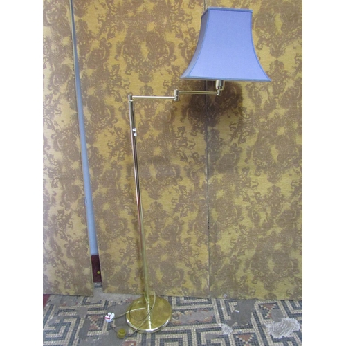 1307 - A contemporary polished brass effect floorstanding standard/reading light with tubular stem and dish... 