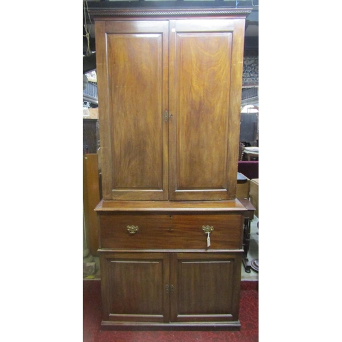 1312 - A Georgian mahogany secretaire with brass button press release fall front, enclosing a pigeon hole a... 