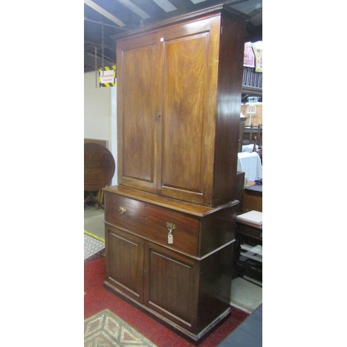 1312 - A Georgian mahogany secretaire with brass button press release fall front, enclosing a pigeon hole a... 