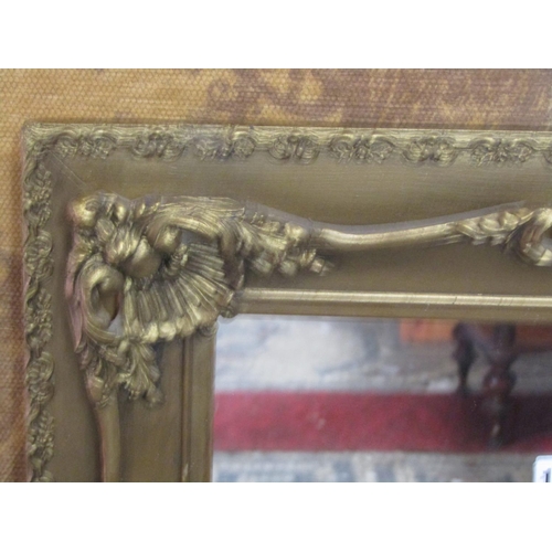 1320 - A swept stepped and moulded rectangular gilt framed wall mirror with scrolling acanthus detail, 69 c... 