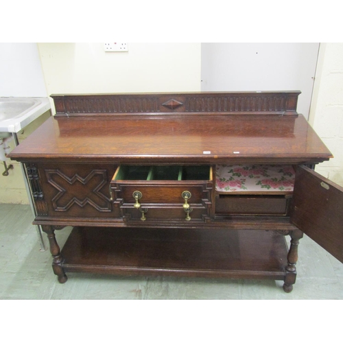 1390 - A Waring & Gillow Ltd Edwardian Jacobean style oak dresser base, the two central drawers flanked by ... 