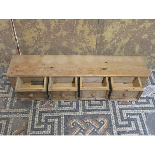 1337 - A stripped pine run of four frieze drawers, 19cm high x 118 cm wide x 24 cm deep