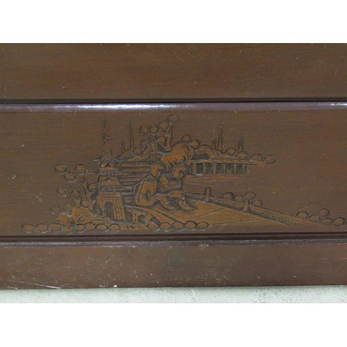 1133 - A camphor wood coffer with hinged lid and carved detail, 40 cm high x 94 cm wide x 46 cm deep