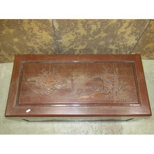 1133 - A camphor wood coffer with hinged lid and carved detail, 40 cm high x 94 cm wide x 46 cm deep