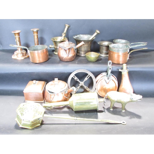 545 - A mixed selection of copper ware, including a tea caddy, a pair of candlesticks, a powder horn, and ... 