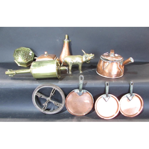 545 - A mixed selection of copper ware, including a tea caddy, a pair of candlesticks, a powder horn, and ... 