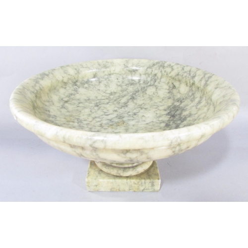 621 - A mottled green alabaster tazza, 30cm diam, raised on a square base.