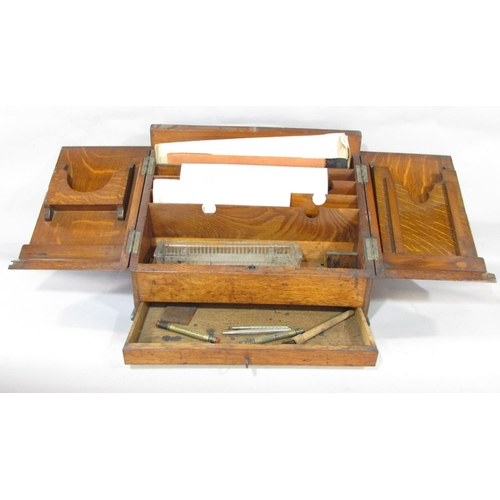 624 - An Edwardian oak desk top stationery box with a fitted interior, together with two mahogany boxes.