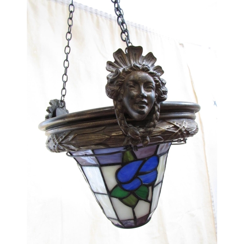 626 - An early 20th century style glass hanging light shade of “leaded” panels with flowers suspended from... 