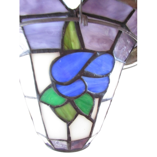 626 - An early 20th century style glass hanging light shade of “leaded” panels with flowers suspended from... 