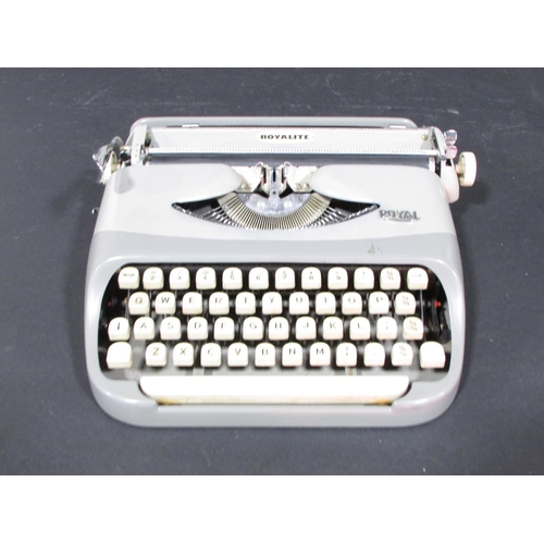 632 - A Royalite portable typewriter circa 1960’s, made by Royal, in its original case and with instructio... 