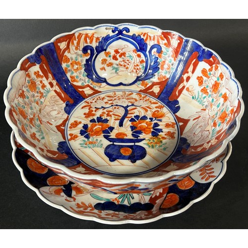 75 - Imari dish of traditional form with scalloped border and a similar dish