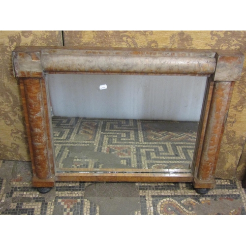 1328 - A Victorian maple veneered chimney glass with split moulded surround on ebonised bun feet, 61 x 76cm... 