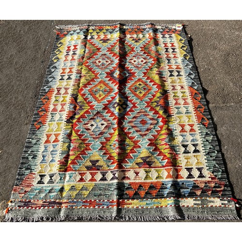 1587 - A Chobi kilim, with a multicolour serrated medallion pattern, 187 x 125cm.