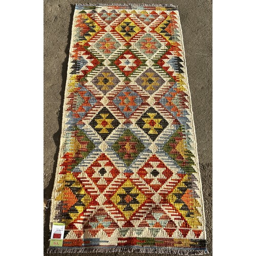 1585 - A Chobi kilim runner,with an all over multicoloured diamond pattern, 148 x 65cm