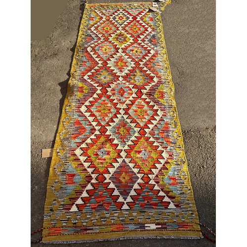 1549 - A Chobi kilim runner with two rows of serrated diamonds, 256 x 83cm