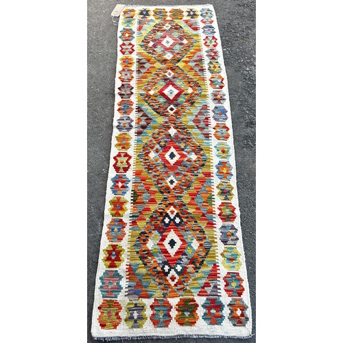 1583 - A Chobi Kilim runner, with a single row of diamond medallions, 193 x 63cm