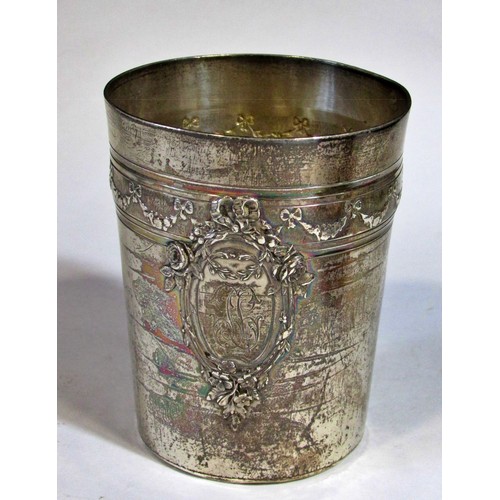 255 - A silver French beaker, bearing the head of Minerva, two napkin rings, a clawed sugar tong, three as... 