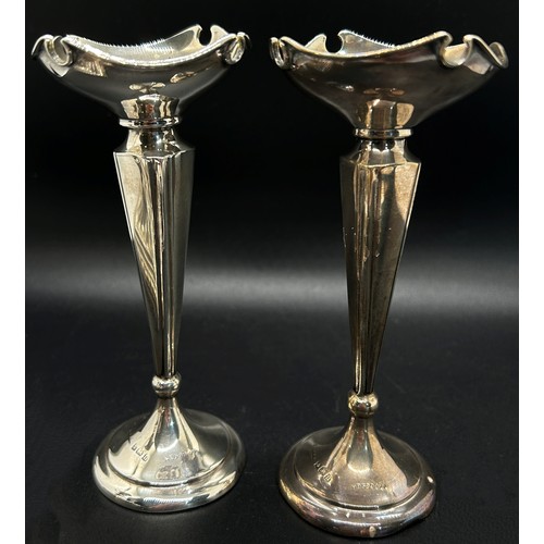 278 - A small pair of 19th century silver candlesticks with removable sconces raised on square stepped bas... 