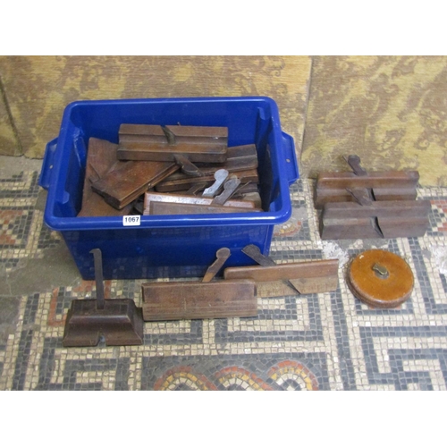 1067 - A box of vintage carpentery moulding planes and a Chesterman’s leather land tape