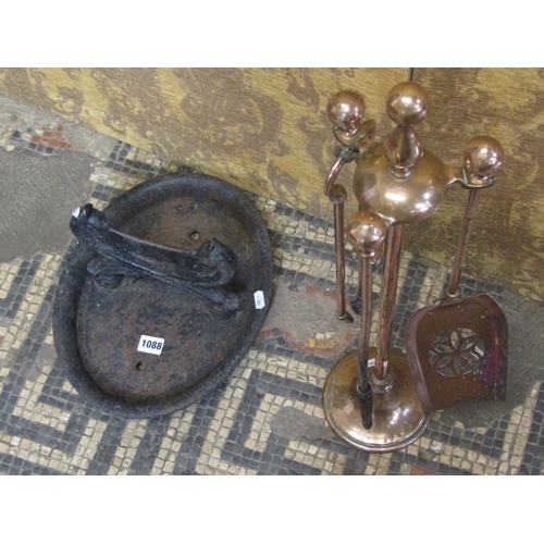 1088 - A cast iron boot scraper with oval tray base together with a companion set (2)