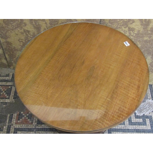 1158 - A small mid 20th century walnut occasional table, raised on cylinder stem and circular foot, with a ... 